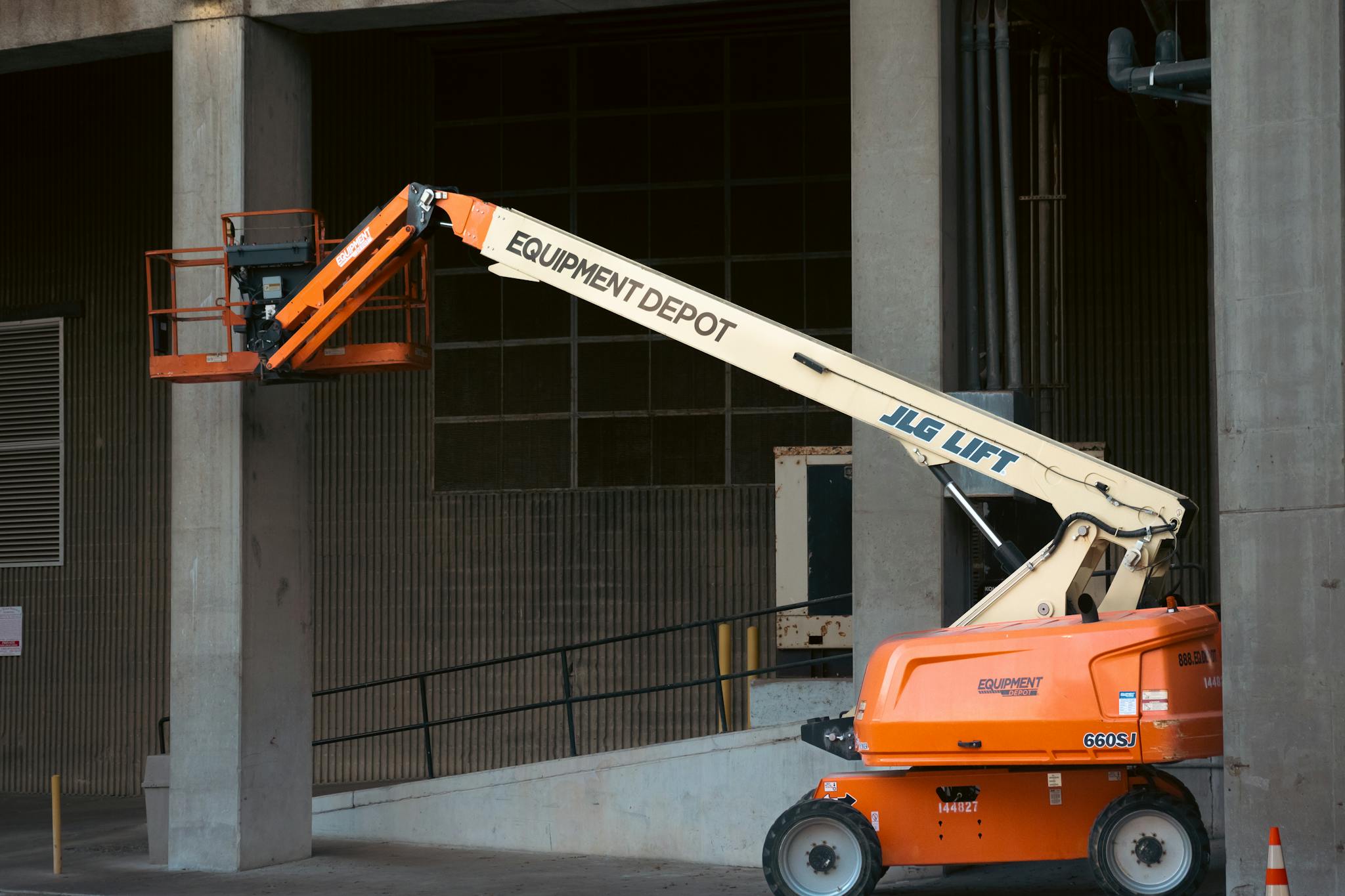 Effective Blog Promotion: Strategies to Increase Your Reach Orange Jlg Lift Positioned At An Industrial